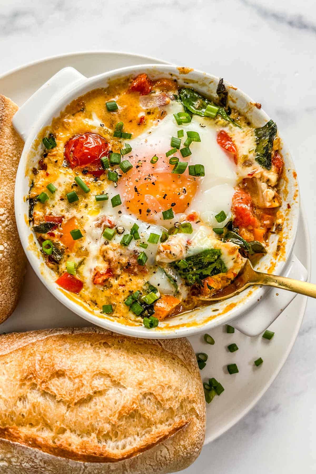 Baked Feta Eggs with Tomatoes and Spinach